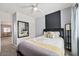Bedroom featuring a full-sized bed, ceiling fan, and a view into the living room at 376 Shanon Springs St, Henderson, NV 89014