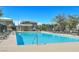 Large community swimming pool with lounge chairs at 376 Shanon Springs St, Henderson, NV 89014