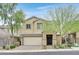 Charming two-story home featuring a well-manicured front yard and attached two-car garage at 376 Shanon Springs St, Henderson, NV 89014