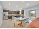 Well-equipped kitchen with granite countertops, stainless steel appliances, and a dining area at 376 Shanon Springs St, Henderson, NV 89014