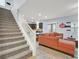 Carpeted staircase leading to an open-concept living room and dining area at 376 Shanon Springs St, Henderson, NV 89014