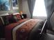 Cozy bedroom featuring a bright window and Southwestern themed bedding at 3781 Desert Marina Dr # 101, Laughlin, NV 89029