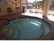 Community hot tub area with a table and chairs, perfect for relaxation at 3781 Desert Marina Dr # 101, Laughlin, NV 89029