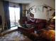 Living room with sliding doors to patio and comfortable seating area at 3781 Desert Marina Dr # 101, Laughlin, NV 89029