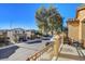 Balcony view overlooking a residential street with neatly landscaped homes and a mature shade tree at 3898 Blake Canyon Dr, North Las Vegas, NV 89032