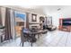 Dining area with sliding doors, fireplace, and modern table set at 4142 Forestville St, North Las Vegas, NV 89032
