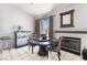 Cozy dining area features tile floors, natural light, and a fireplace at 4142 Forestville St, North Las Vegas, NV 89032