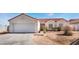 Cozy one-story home with a two-car garage and low maintenance landscaping at 4142 Forestville St, North Las Vegas, NV 89032