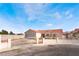 Charming single-story home featuring a red tile roof and gated front yard at 4142 Forestville St, North Las Vegas, NV 89032