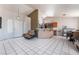 Open-concept living space with tile flooring, breakfast bar, and plenty of natural light at 4142 Forestville St, North Las Vegas, NV 89032