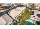Home with a tile roof and backyard pool oasis featuring lush landscaping in a well-kept neighborhood at 4712 Stavanger Ln, Las Vegas, NV 89147