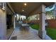 Backyard patio with outdoor kitchen and bar seating under covered patio at 4712 Stavanger Ln, Las Vegas, NV 89147