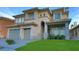 Beautiful two-story home with a three-car garage, manicured lawn, and inviting front porch at 4712 Stavanger Ln, Las Vegas, NV 89147