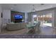 Bright Gathering room features modern lighting, stylish furnishings, and access to the backyard at 4712 Stavanger Ln, Las Vegas, NV 89147