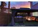 Inviting outdoor space featuring a jacuzzi under a gazebo and a cozy firepit with comfortable seating at 4712 Stavanger Ln, Las Vegas, NV 89147