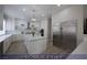 Modern kitchen with a spacious island, stainless steel appliances and white cabinets at 4712 Stavanger Ln, Las Vegas, NV 89147