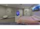 This main bedroom features soft carpet, recessed lights, unique wall art and a innovative, built-in pop-up TV at 4712 Stavanger Ln, Las Vegas, NV 89147
