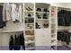 This is a large, well-lit walk-in closet with rods and shelving for organization and storage at 4712 Stavanger Ln, Las Vegas, NV 89147