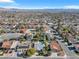 Lush aerial view of a vibrant neighborhood with mature trees and private swimming pools, showing the landscape at 5050 Grandview Dr, Las Vegas, NV 89120