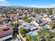 Residential aerial view of neighborhood homes, landscaping, sparkling pools and mountain views at 5050 Grandview Dr, Las Vegas, NV 89120