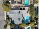 Overhead view of home, patio cover, manicured yard, mature trees and diving pool at 5050 Grandview Dr, Las Vegas, NV 89120