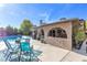 Spacious backyard with a sparkling pool, covered patio, outdoor seating, and lush greenery, perfect for entertaining at 5050 Grandview Dr, Las Vegas, NV 89120