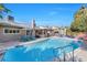 Backyard featuring a sparkling pool, a hot tub, covered patio, and comfortable seating, great for outdoor living at 5050 Grandview Dr, Las Vegas, NV 89120
