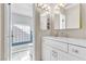 Updated bathroom boasts a double vanity with white cabinetry and modern fixtures at 5050 Grandview Dr, Las Vegas, NV 89120