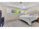 A serene bedroom with a comfortable bed and a large window overlooking the trees at 5050 Grandview Dr, Las Vegas, NV 89120