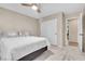 Well-lit bedroom features plush carpeting, ceiling fan and a large closet with white sliding doors at 5050 Grandview Dr, Las Vegas, NV 89120