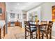 The dining area features wood-look floors, a dining set and an adjacent kitchen at 5050 Grandview Dr, Las Vegas, NV 89120