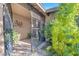 View of the home's tile front porch, iron security gate, and front door at 5050 Grandview Dr, Las Vegas, NV 89120