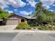 Charming single-story home with a well-maintained front yard and a two-car garage at 5050 Grandview Dr, Las Vegas, NV 89120