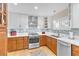 Updated kitchen with stainless appliances, two-tone cabinets, white marble countertop, and stylish backsplash at 5050 Grandview Dr, Las Vegas, NV 89120