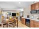 Modern kitchen and dining area with updated countertops and appliances, creating a seamless open-concept living space at 5050 Grandview Dr, Las Vegas, NV 89120