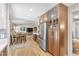 Spacious open kitchen with modern stainless steel refrigerator and elegant wooden cabinets at 5050 Grandview Dr, Las Vegas, NV 89120