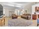 Open-concept living room with wood-look floors leading to the kitchen at 5050 Grandview Dr, Las Vegas, NV 89120