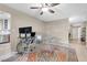 Home office with a glass desk and a stylish rug next to a modern kitchen at 5050 Grandview Dr, Las Vegas, NV 89120