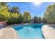 Inviting backyard pool with mature landscaping, diving board, and concrete surround at 5050 Grandview Dr, Las Vegas, NV 89120
