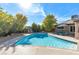 Refreshing backyard pool surrounded by lush landscaping and lounge chairs for relaxing on sunny days at 5050 Grandview Dr, Las Vegas, NV 89120