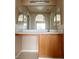 Bathroom with a vanity featuring double mirrors and cabinet storage at 5236 El Prado Heights St, North Las Vegas, NV 89081