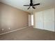 Spacious bedroom features a ceiling fan and a double-door closet for ample storage at 5236 El Prado Heights St, North Las Vegas, NV 89081