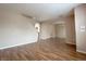Open living room with hardwood floors and arched doorways at 5236 El Prado Heights St, North Las Vegas, NV 89081