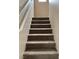 Carpeted staircase with a white railing leading to the upper level at 5236 El Prado Heights St, North Las Vegas, NV 89081