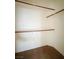 Walk-in closet featuring built-in shelves for organized storage and neutral carpet at 5236 El Prado Heights St, North Las Vegas, NV 89081