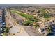 An aerial view of a community featuring a golf course, desert walking trails and landscaping at 589 Via Medici, Henderson, NV 89011