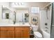 Clean bathroom featuring a white countertop, wooden cabinets, and shower/tub combo at 589 Via Medici, Henderson, NV 89011