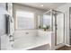 The primary bathroom features a soaking tub and a glass enclosed shower at 589 Via Medici, Henderson, NV 89011