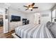 The main bedroom features a ceiling fan and space for both a bed and an office at 589 Via Medici, Henderson, NV 89011