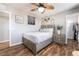 Comfortable bedroom with light grey walls, wood floors, and walk-in closet at 589 Via Medici, Henderson, NV 89011